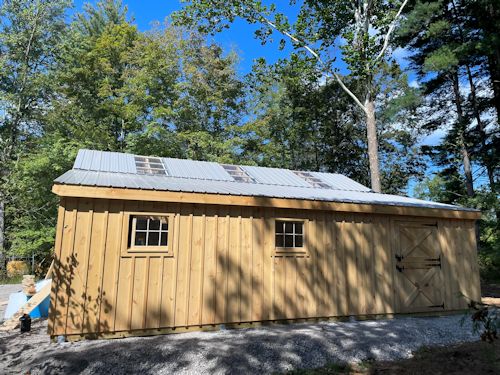 Low Profile Barn with Metal Roof and Skylights